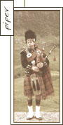 a piper in the traditional kilt